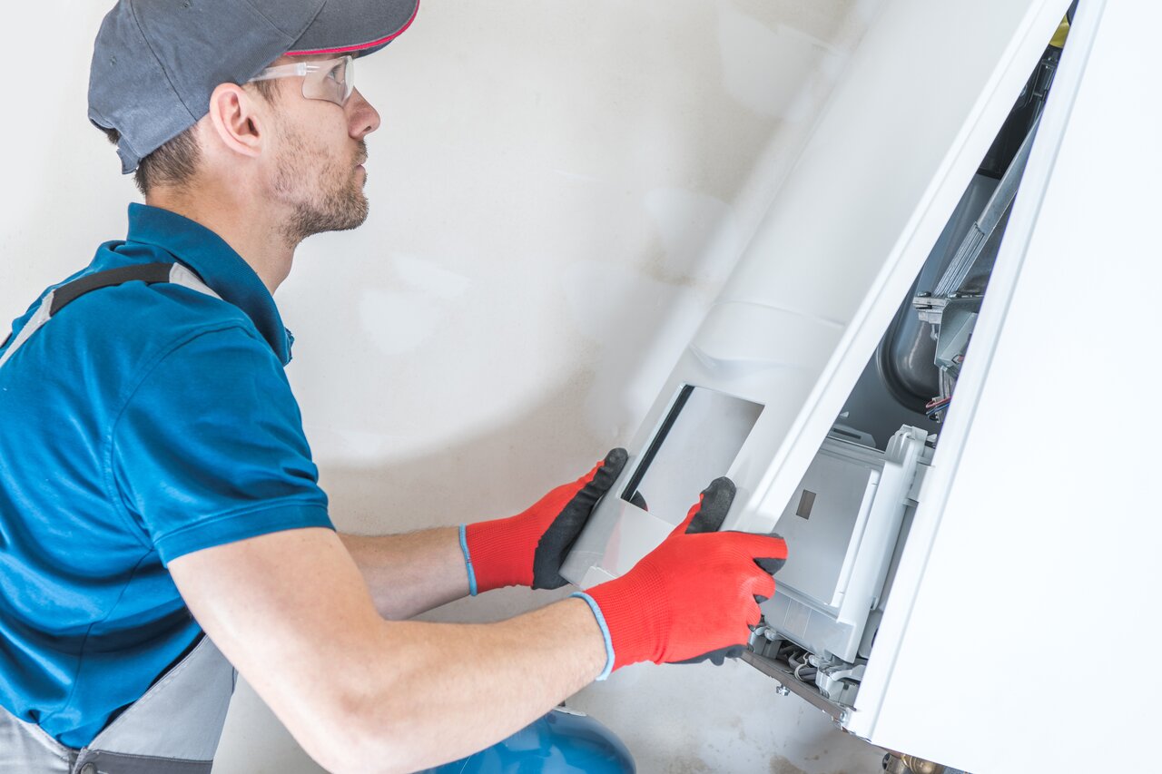 A professional technician repairing a Furnace system